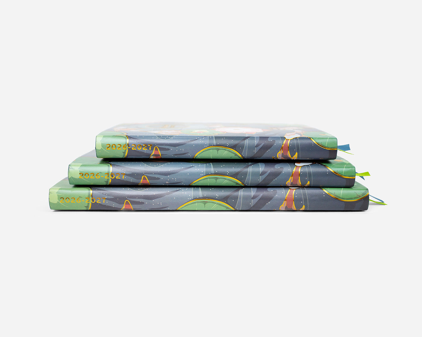 Stack of three patterned 2026-2027 planners on a white background