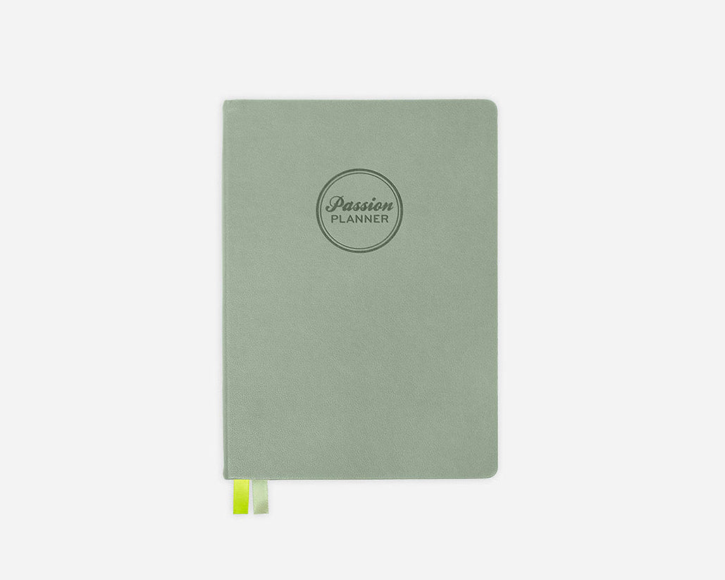 Green hardcover planner with 'Passion Planner' logo on a white background