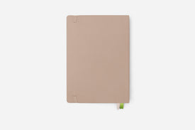Beige notebook on a white background