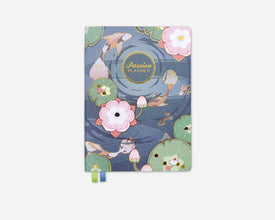 Koi fish pond design on a notebook with 'Passion Planner' branding on a white background