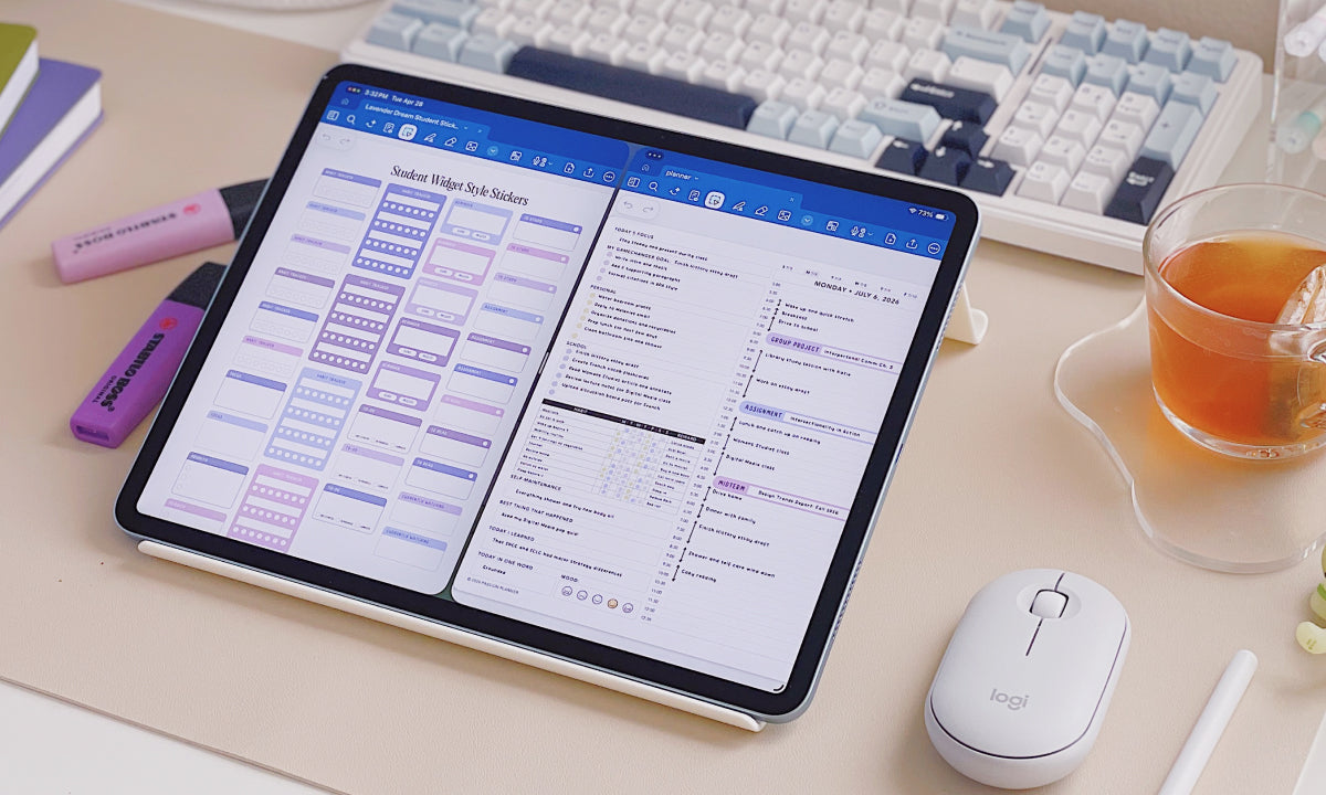 Tablet displaying a digital planner on a desk with a keyboard, mouse, and cup of tea.