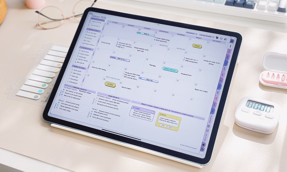 Tablet displaying a digital calendar on a desk with office supplies.