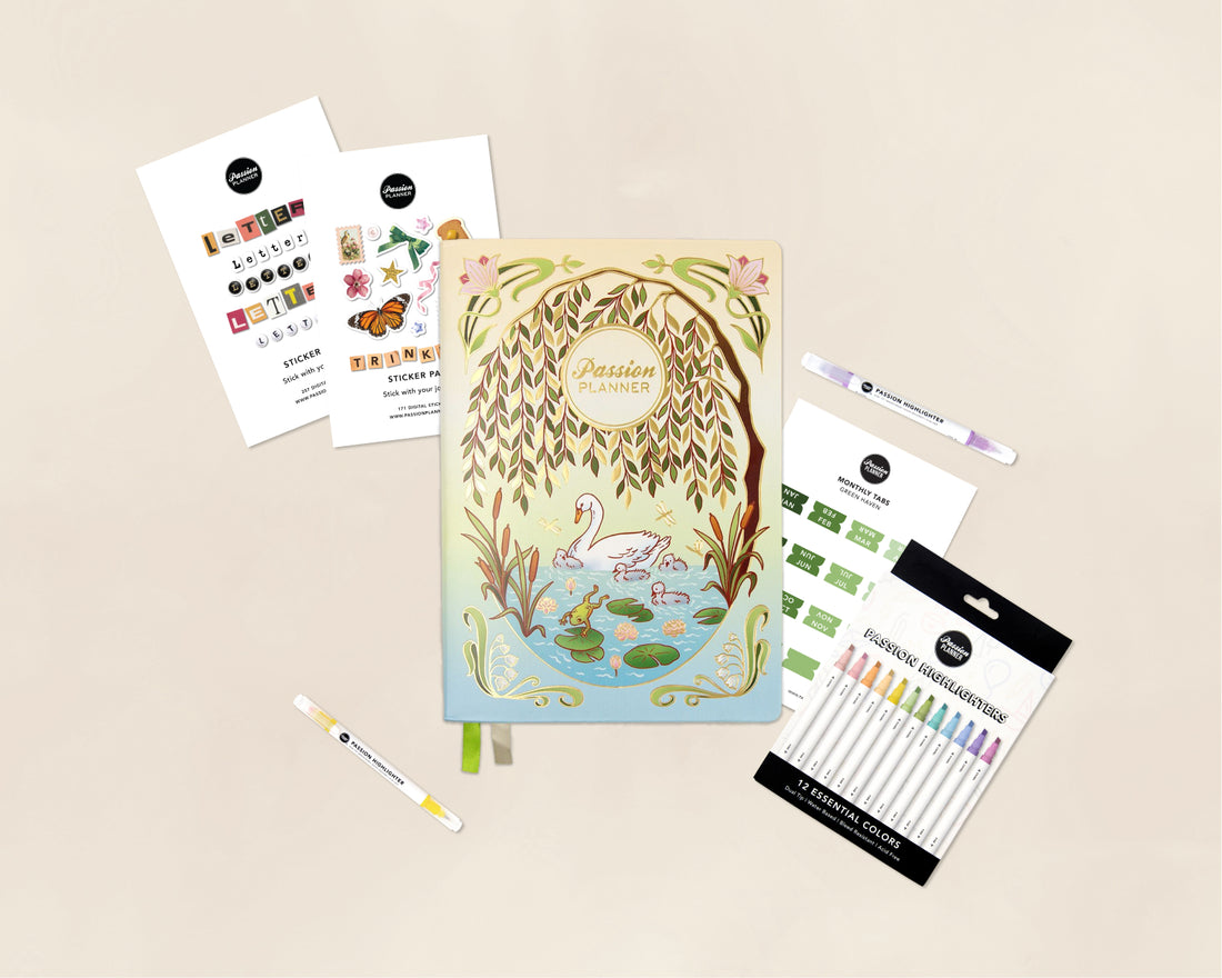 A stationery flat lay featuring a pastel illustrated planner titled &