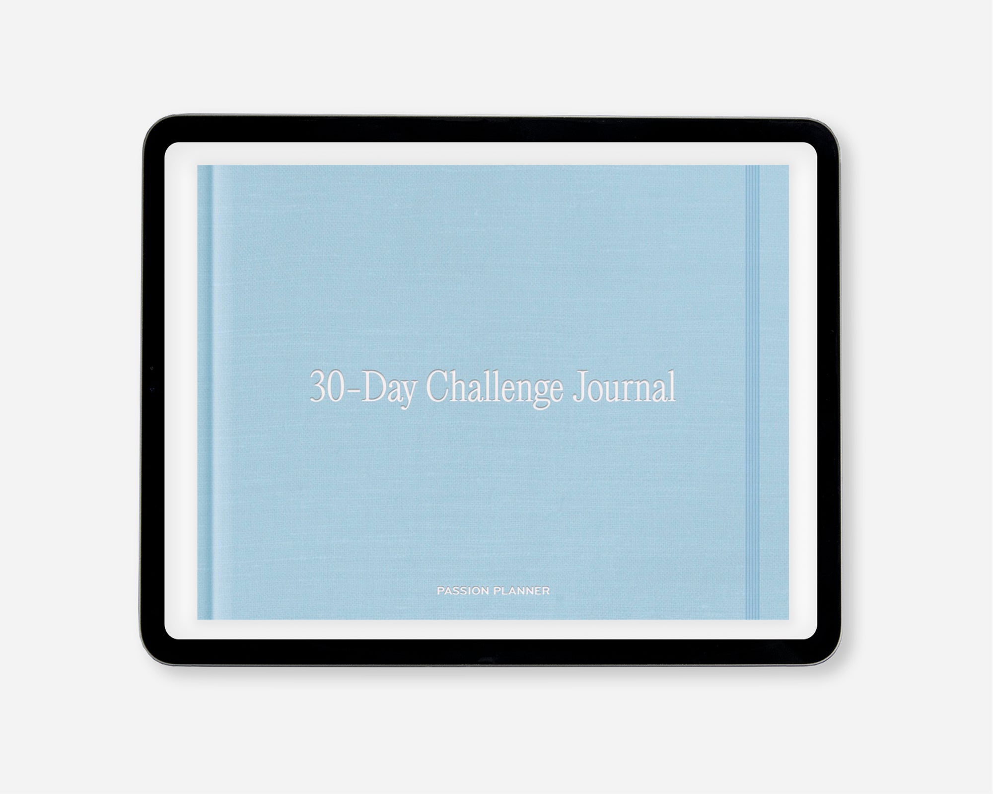A 30-Day Challenge Journal by Passion Planner, featuring a light blue textured cover with white text, within a black tablet screen, shown on a light gray background.