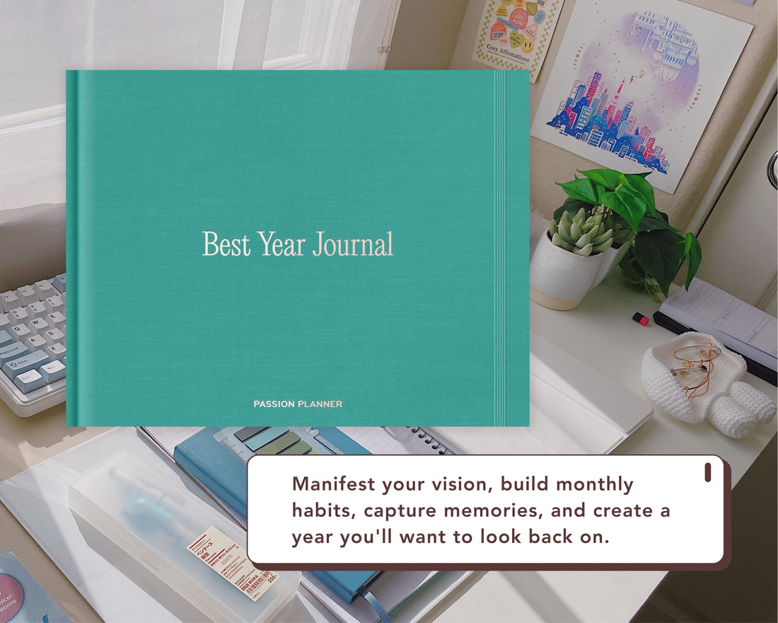 A teal Best Year Journal by Passion Planner is displayed on a desk with a white text overlay that reads &