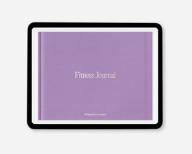 A digital fitness journal with a textured lavender purple cover, featuring the words 'Fitness Journal' in a light beige serif font. The journal is presented in a black tablet-style frame against a clean, light gray background.