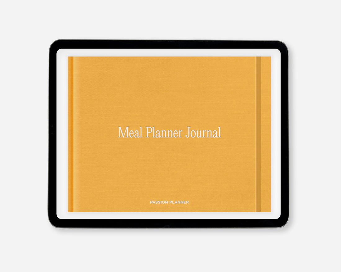 A yellow-orange digital meal planner journal shown on a tablet, featuring the text &