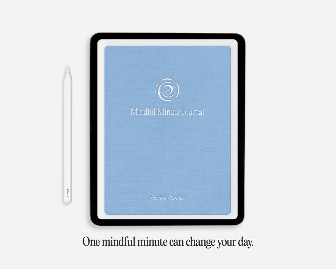 A tablet-style digital journal cover with a light blue front and black border, shown on a light gray background with a white stylus beside it and the text &