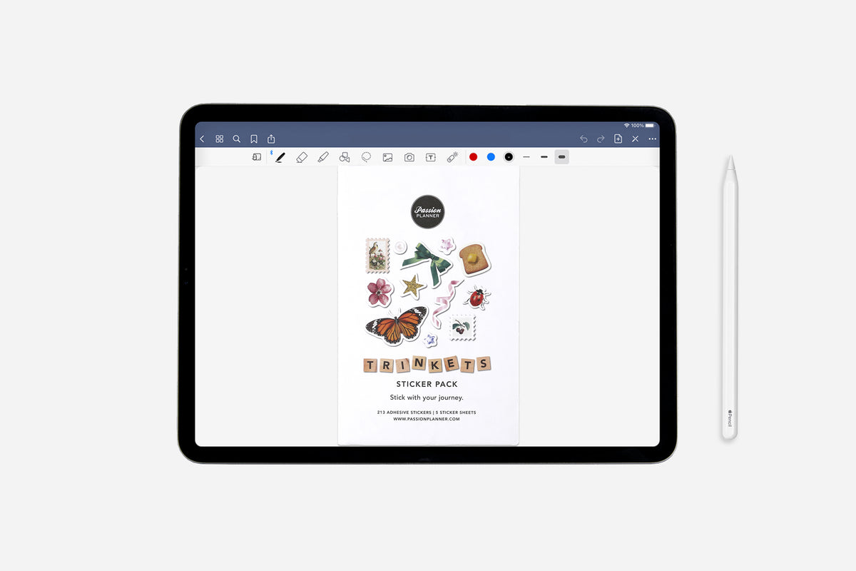 iPad displaying a trinkets sticker pack on a white background with a stylus next to it
