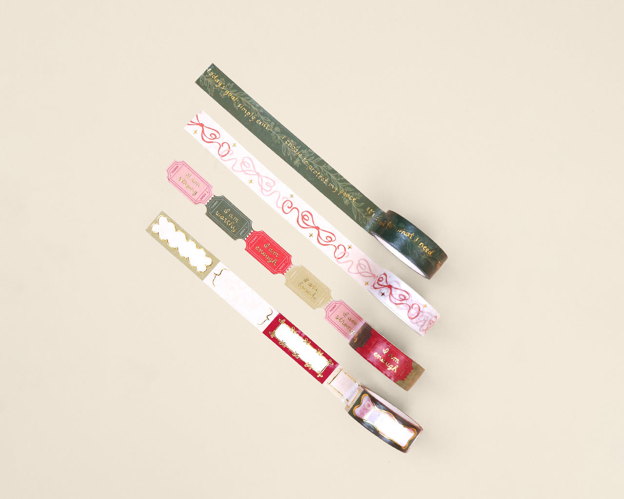 Set of colorful washi tape with text on a beige background