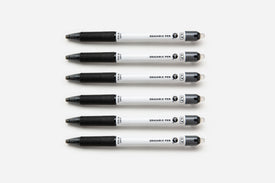 Six soft black pens lined up on a white background.
